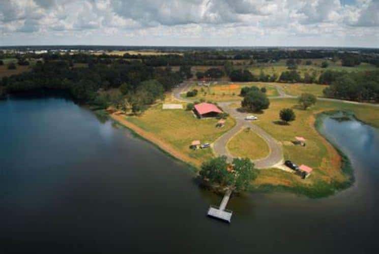 Aerial view of a body of water with a small pier